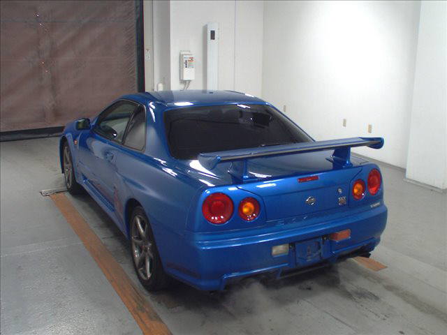 1999 Nissan Skyline R34 GT-R VSpec TV2 Bayside Blue auction left rear